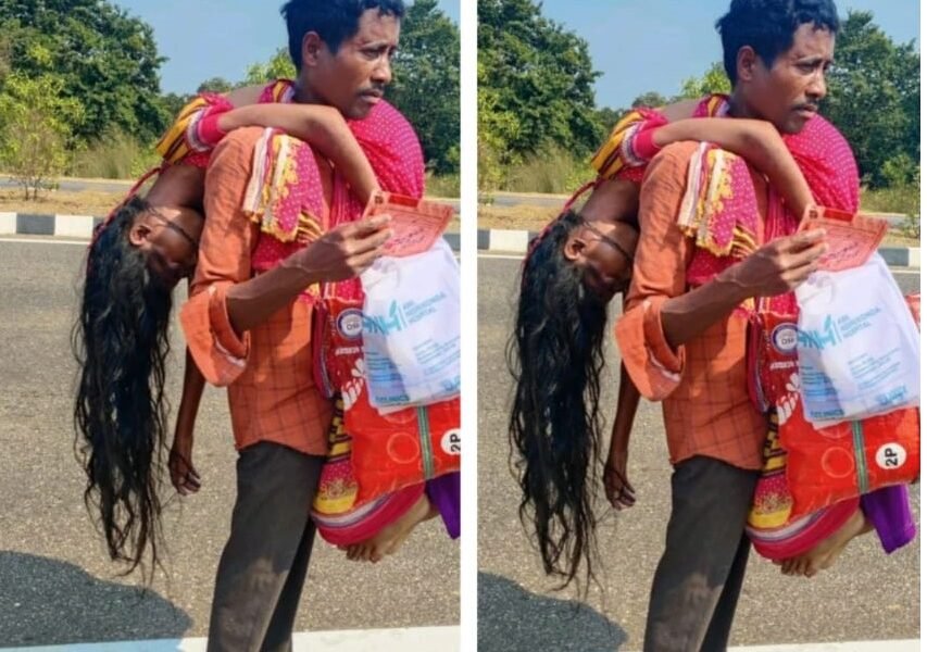 man carrying his wife's dead body
